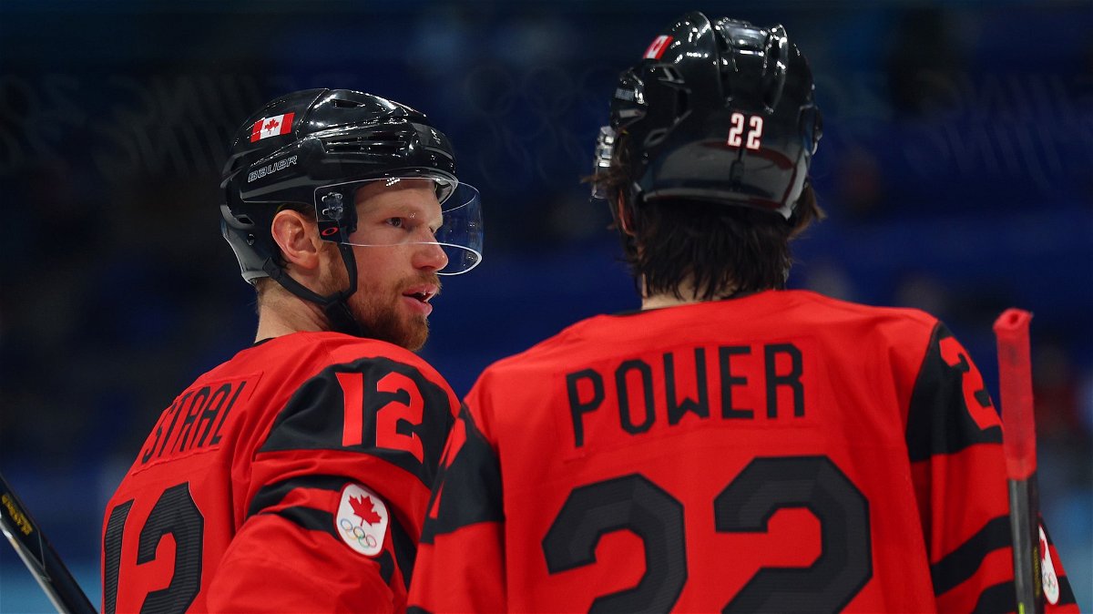 Eric Staal of Team Canada talks with Owen Power during the third period of the men's ice hockey preliminary round Group A match between Team Canada and Team USA