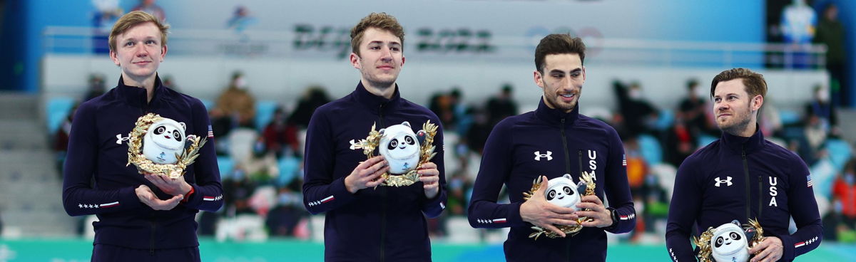 Bronze medalists Team USA pose during the men's team pursuit finals flower ceremony on Day 11 of the 2022 Winter Olympics