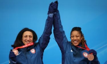 Bronze medal winners Elana Meyers Taylor and Sylvia Hoffman of Team USA pose for a photo with their medals