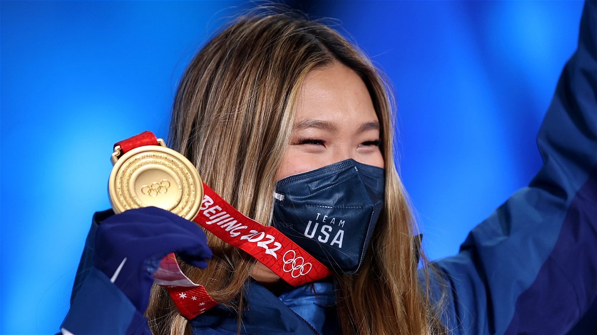 Gold medalist Chloe Kim of Team United States poses with their medal during the Women's Snowboard Halfpipe medal ceremony