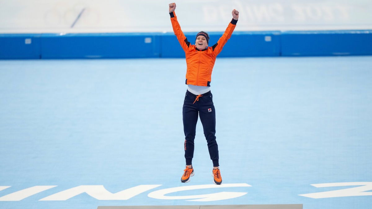 Ireen Wuest celebrates on the podium