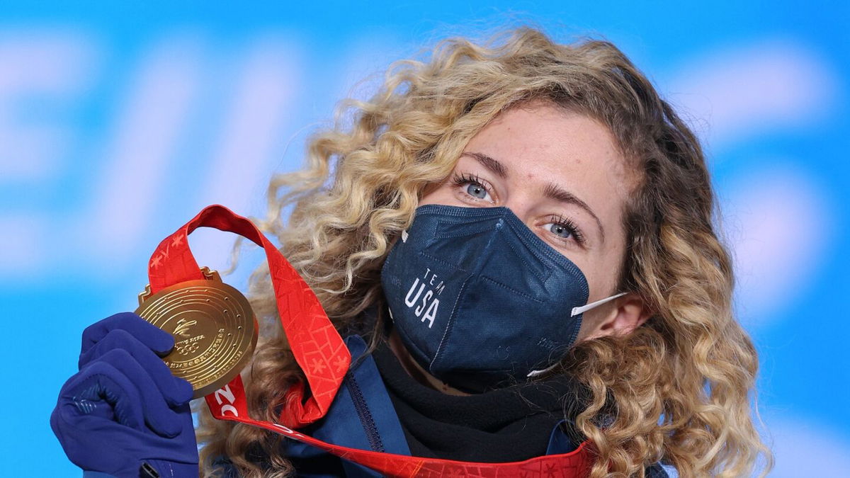 Gold medalist Lindsey Jacobellis of Team USA poses with their medal during the Women's snowboard cross medal ceremony