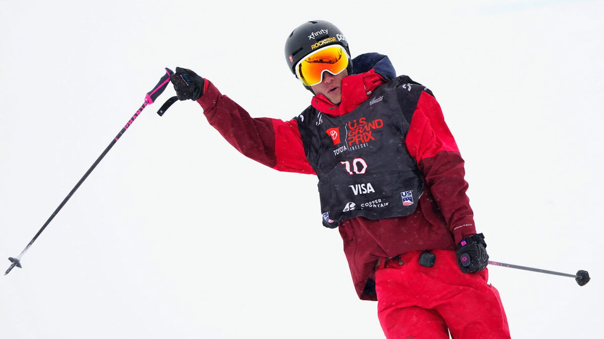 Alex Ferreira whips his ski poles after a halfpipe run