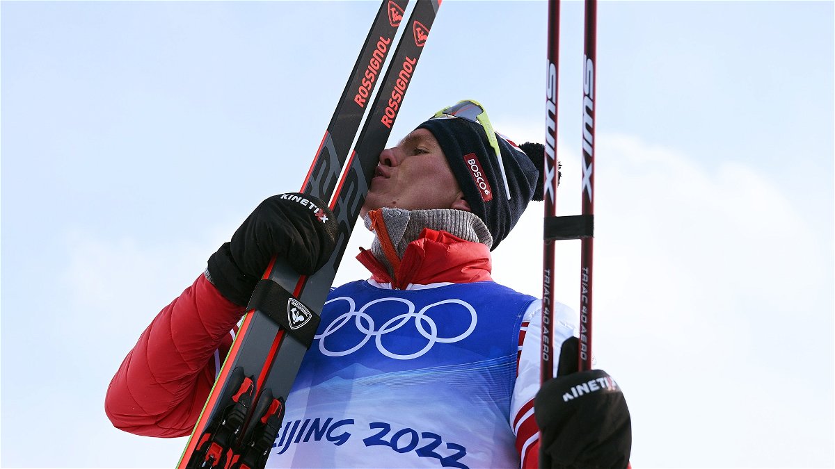 Alexander Bolshunov of Team ROC poses after winning the Gold medal during the Men's Cross-Country Skiing 30km Mass Start Free