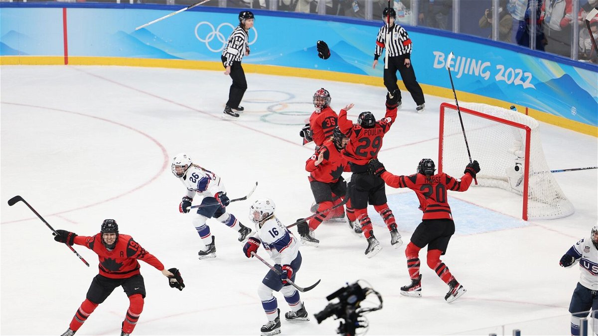 Canada celebrates winning the gold medal.