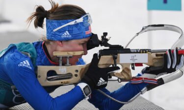 Clare Egan shooting during an Olympic biathlon event