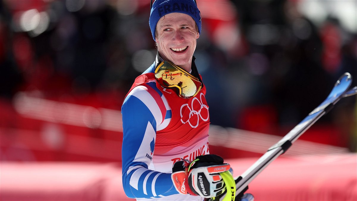 Clement Noel of France celebrates winning the gold medal in the men's slalom at the 2022 Winter Olympics.