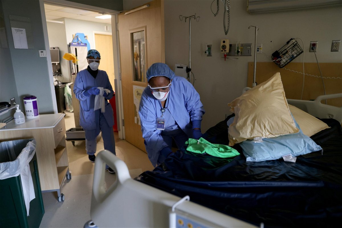 <i>Karen Ducey/Getty Images</i><br/>Environmental Services workers Haimanot Gebre (L) and Aster Mekonen deep clean a non-Covid room with disinfectant in the acute care unit at the Harborview Medical Center on January 21