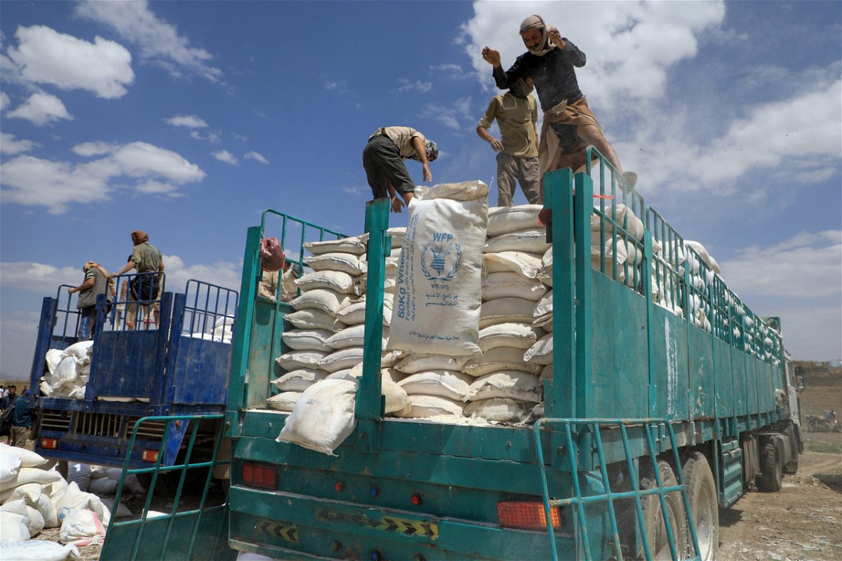<i>Mohammed Huwais/AFP/Getty Images</i><br/>Yemen's Houthi rebels dispose of expired aid packages from the World Food Programme (WFP) in the capital Sanaa in 2019.