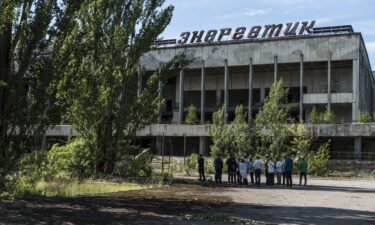 Tourists are guided around the abandoned city of Pripyat