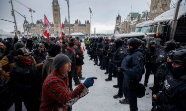 Police move in to clear protesters from downtown Ottawa near Parliament Hill on Saturday
