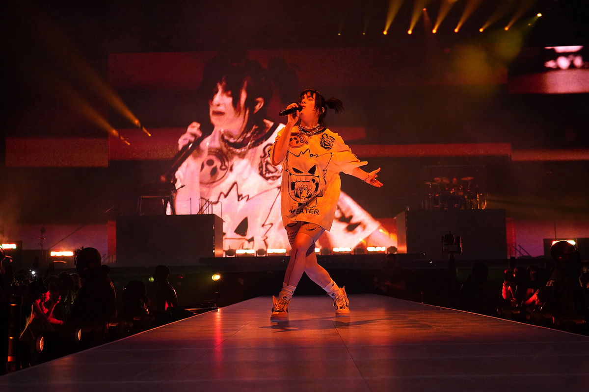 <i>Kevin Mazur/Getty Images</i><br/>Billie Eilish was performing at State Farm Arena in Atlanta on her Happier Than Ever world tour when she stopped her concert to help out a fan in the crowd. Eilish is shown here onstage at Smoothie King Center on February 03