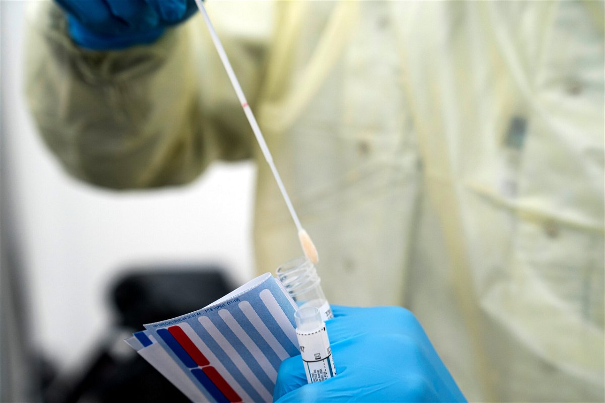 <i>Niels Christian Vilmann/AP</i><br/>A medical worker operates a test for coronavirus