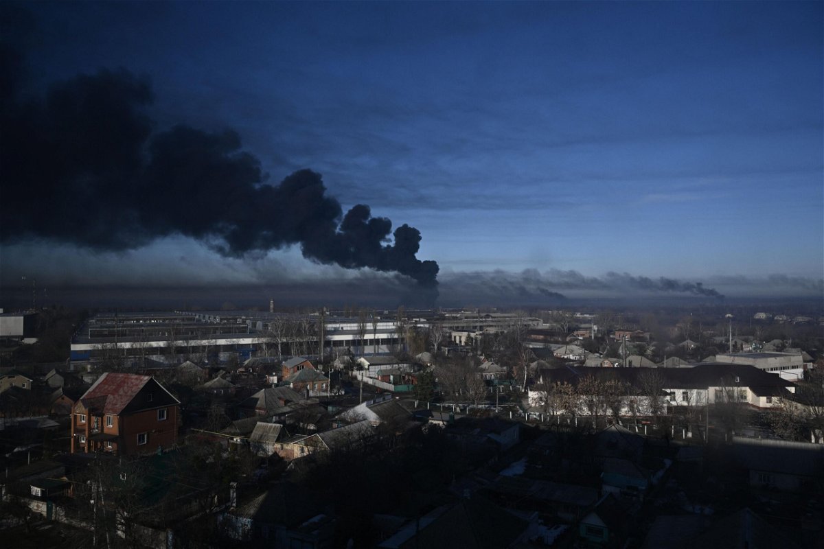 <i>Aris Messinis/AFP/Getty Images</i><br/>Black smoke rises from a military airport in Chuguyev near Kharkiv on February 24