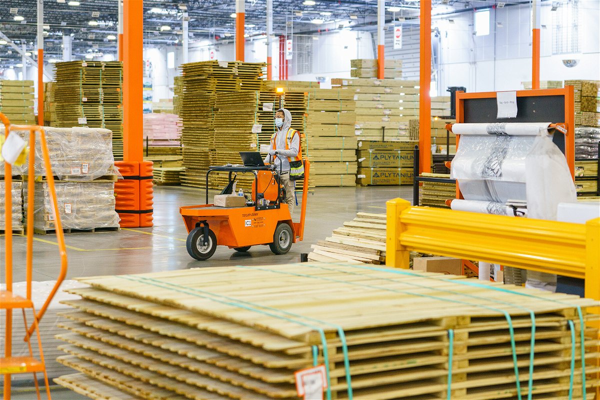 <i>Elijah Nouvelage/Bloomberg/Getty Images</i><br/>An employee works inside the Home Depot flatbed distribution center in Stonecrest