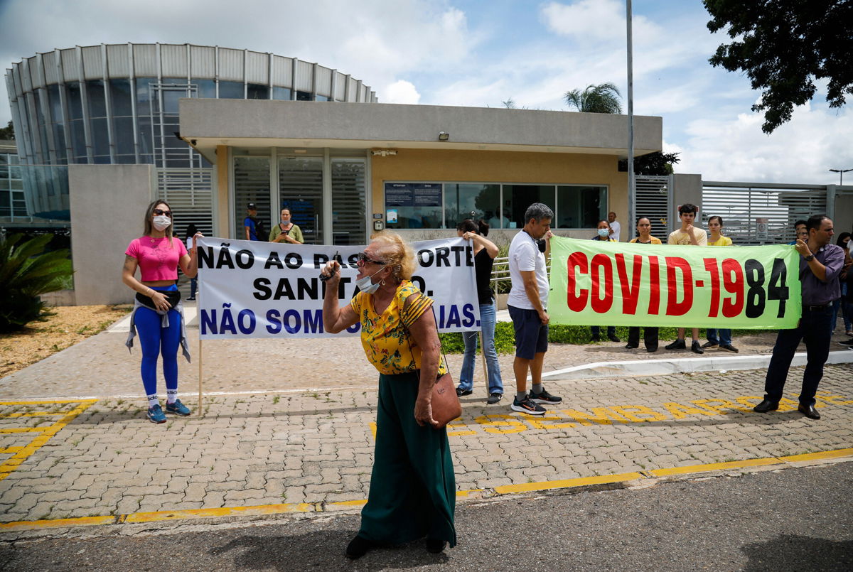 <i>Sergio Lima/AFP/Getty Images</i><br/>Bolsonaro supporters demonstrate against Covid-19 vaccines outside the Pan American Health Organization headquarters in Brasilia on January 4.