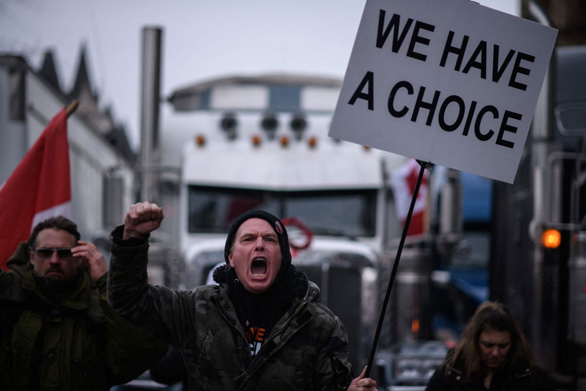 <i>Ed Jones/AFP/Getty Images</i><br/>Canadian protesters are now defying a court order as they block a critical route into USA. Pictured are protesters in Ottawa on February 11.