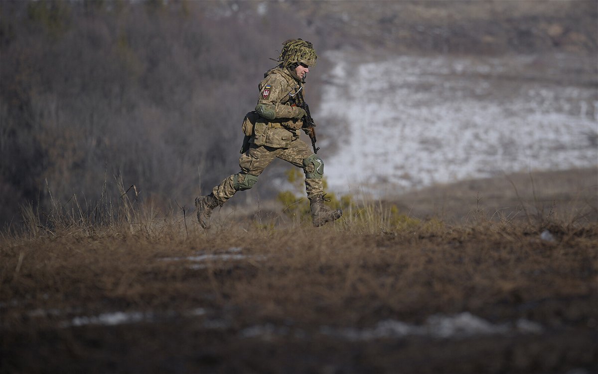 <i>Vadim Ghirda/AP</i><br/>A Ukrainian serviceman runs during an exercise in the Joint Forces Operation