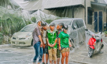 Having a family portrait taken by Haruhiko Kawaguchi comes with one unusual condition: That he wrap your entire house in plastic and then vacuum-seal you into an airtight bag.