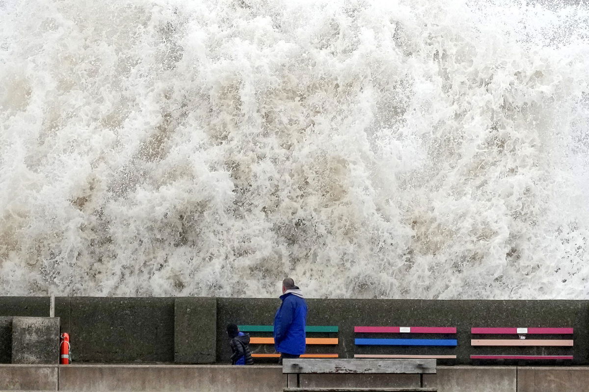 <i>Christopher Furlong/Getty Images</i><br/>Waves crash into a sea wall in Liverpool