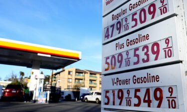 Gasoline prices are displayed at a gas station on February 8 in Los Angeles