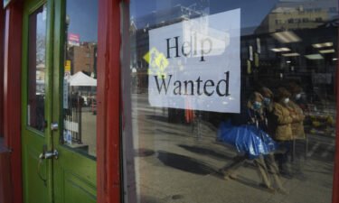 America lost jobs in January. A store is seen with hiring signs on February 01 in Washington DC.