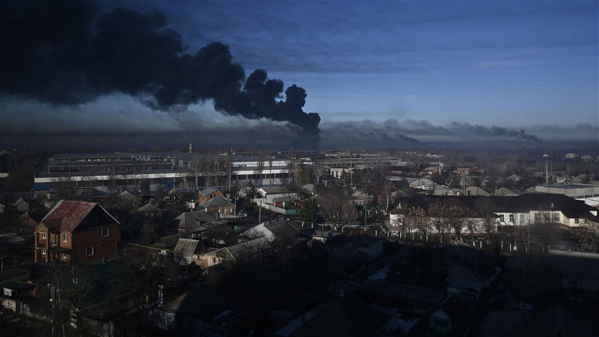 <i>Aris Messinis/AFP/Getty Images</i><br/>Black smoke rises from a military airport in Chuguyev near Kharkiv  on Thursday.