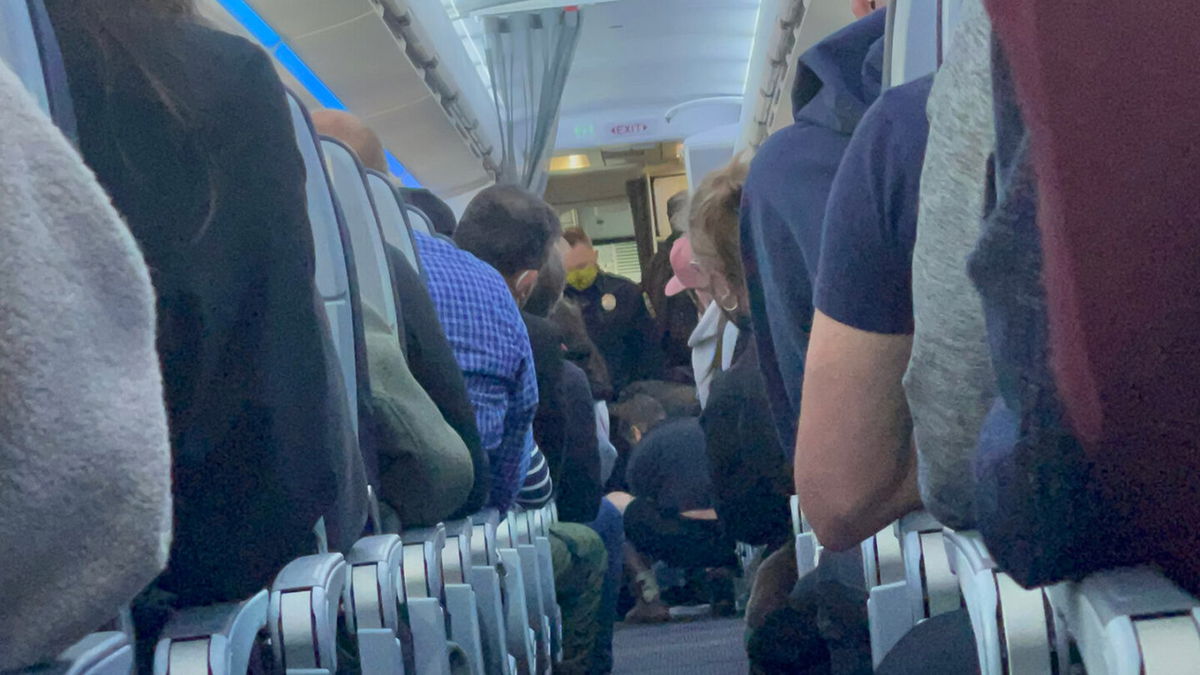 <i>Mouaz Moustafa/Twitter</i><br/>An eyewitness told CNN the passenger was trying to get into the cockpit and open the plane door.