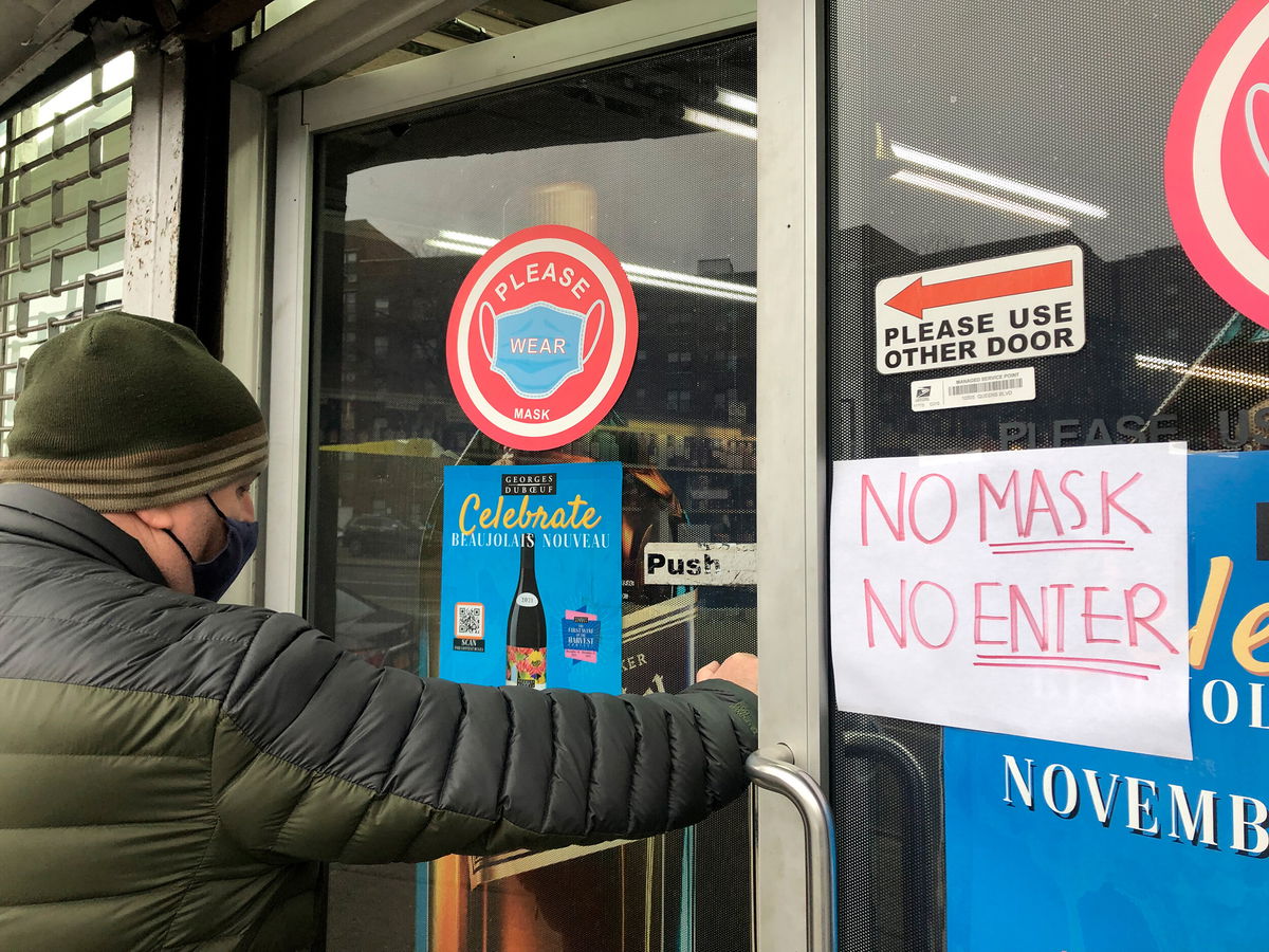 <i>Lindsey Nicholson/UCG/Universal Images Group/Getty Images</i><br/>Man entering store with a No Mask