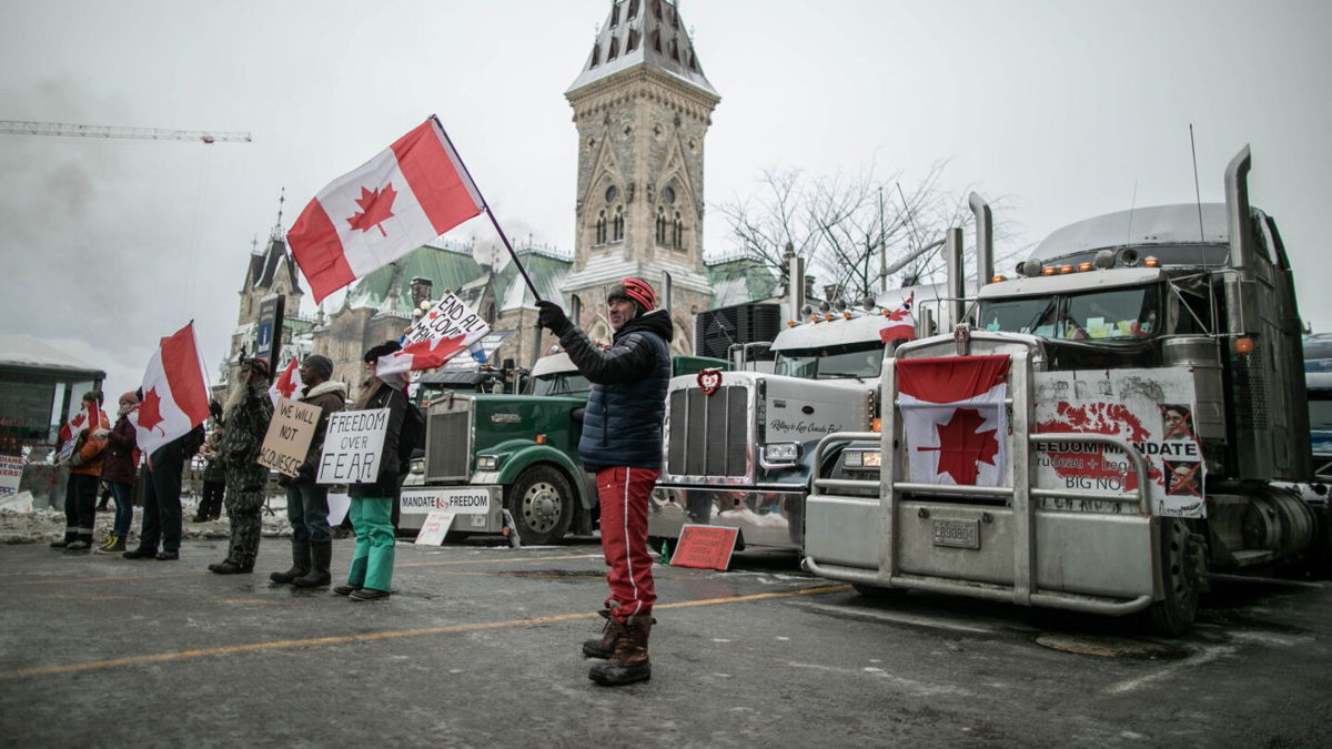 <i>Amru Salahuddien/Anadolu Agency via Getty Images</i><br/>Truckers continue to voice their opposition to coronavirus measures and vaccine mandates in Ottawa