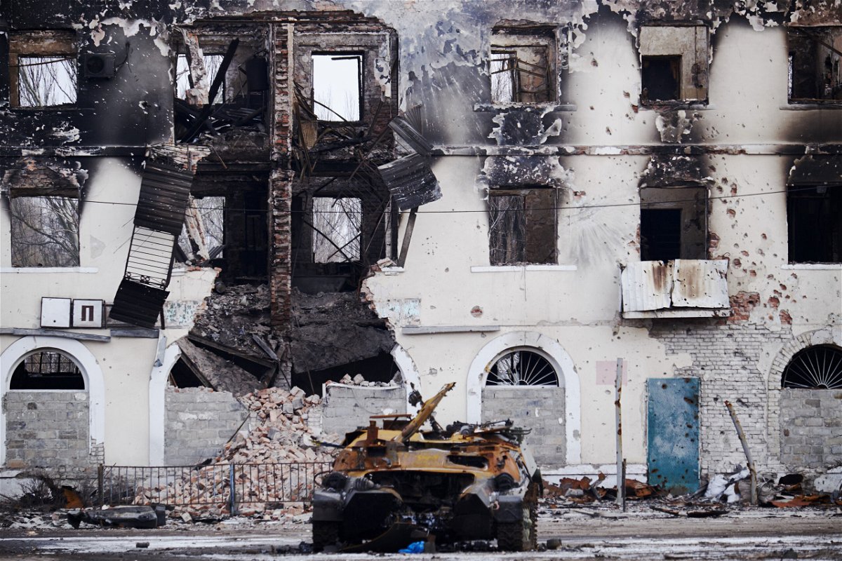 <i>Pierre Crom/Getty Images</i><br/>A burned military vehicle in front of a destroyed building in Uglegorsk
