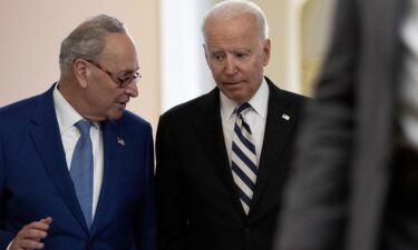 President Joe Biden departs from the US Capitol with Senate Majority Leader Chuck Schumer in July 2021.