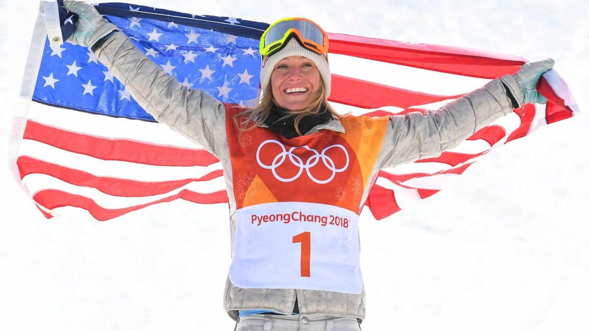 Jamie Anderson holds up a U.S. flag