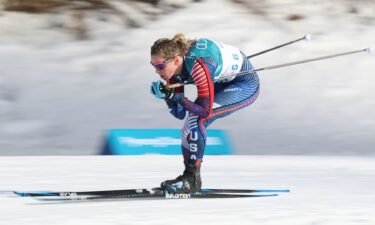 Jessie Diggins in a crouching position as she skis a race