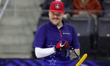 Matt Hamilton of the United States reacts after delivering a stone.