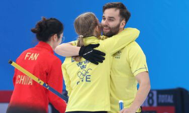 Swedish athletes celebrate their victory over China
