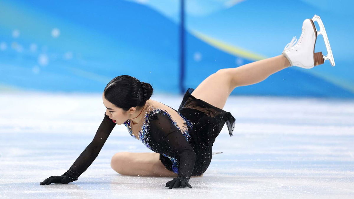 Karen Chen falls onto the ice