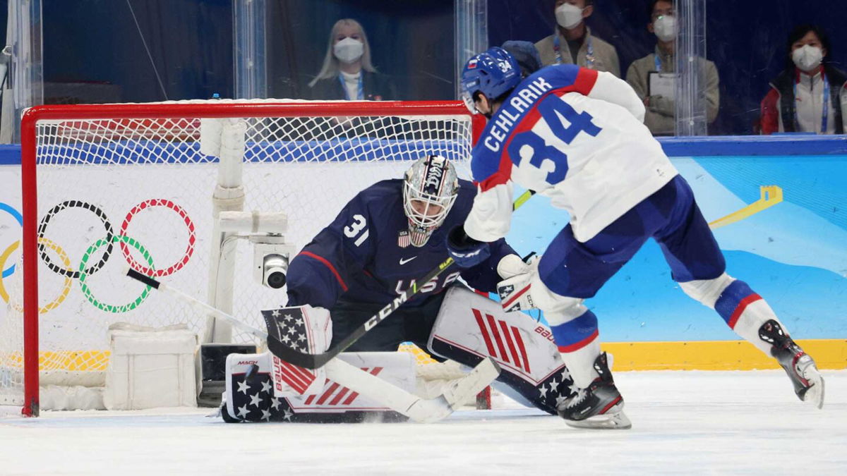 Slovakia hockey player shoots at U.S> goalie