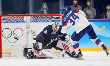 Slovakia hockey player shoots at U.S> goalie