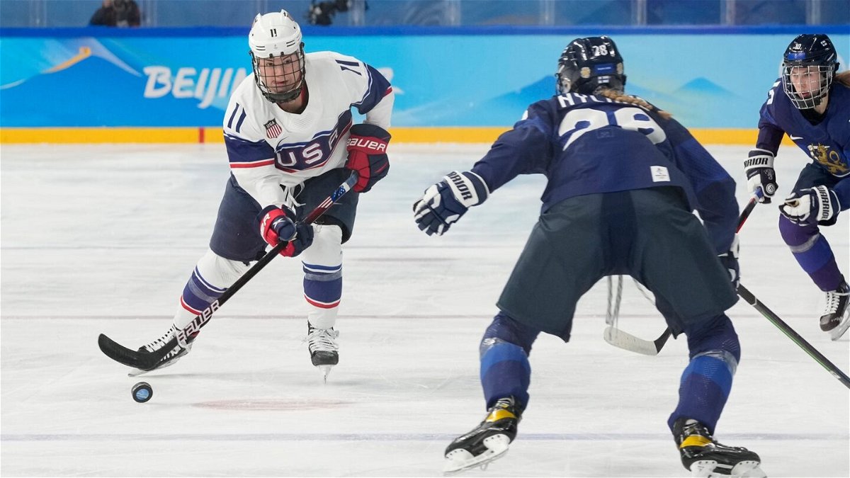 Abby Roque skates with the puck against Finland.