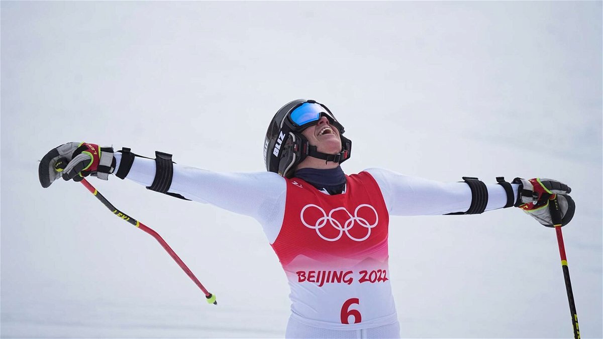 Sara Hector from Sweden celebrates at the finish after winning the women's giant slalom at the 2022 Winter Olympics.