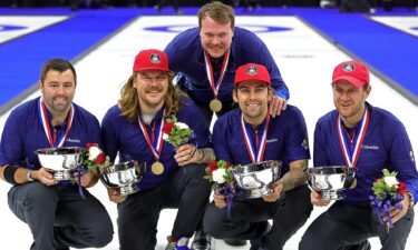 Team Shuster poses with medals
