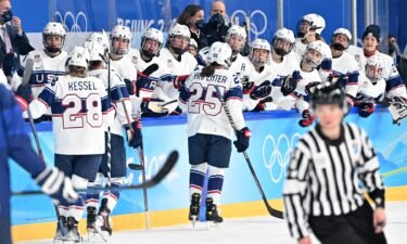 Team USA celebrates after scoring a goal against Finland.
