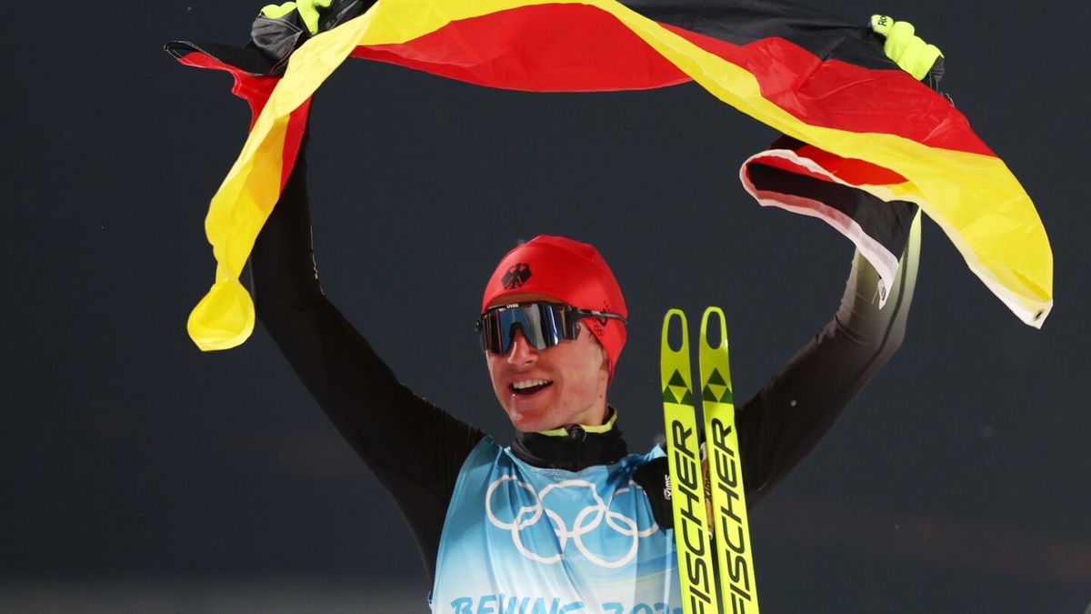 Vinzenz Geiger of Team Germany celebrates winning the Gold medal following the Nordic Combined Individual Gundersen Normal Hill/10km