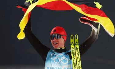 Vinzenz Geiger of Team Germany celebrates winning the Gold medal following the Nordic Combined Individual Gundersen Normal Hill/10km