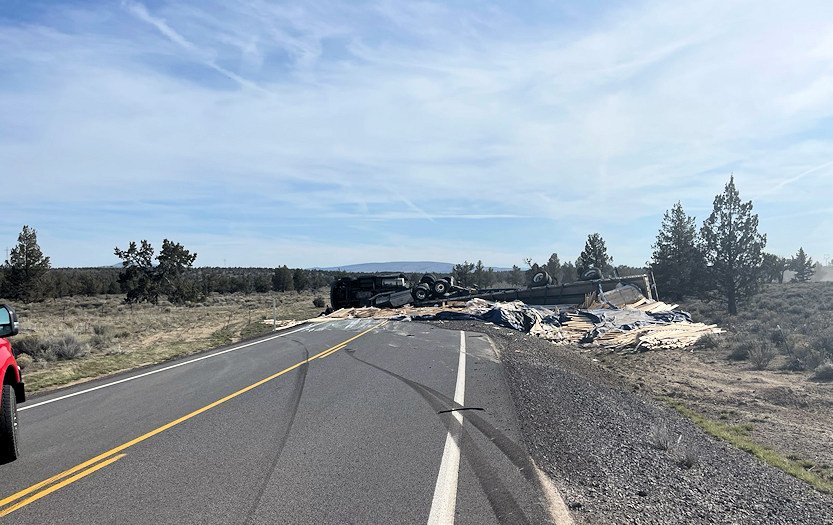 Semi spilled load of wood products in rollover crash Friday on George Millican Road