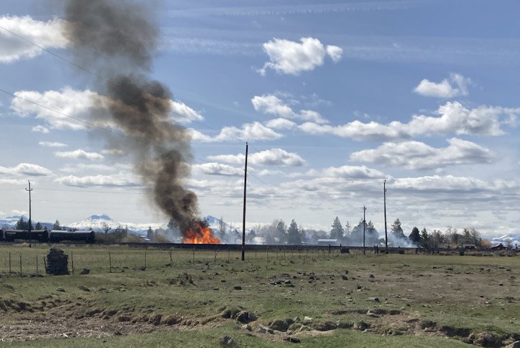 Escaped burn put up flames, black smoke near railroad tracks in NW Redmond Thursday afternoon