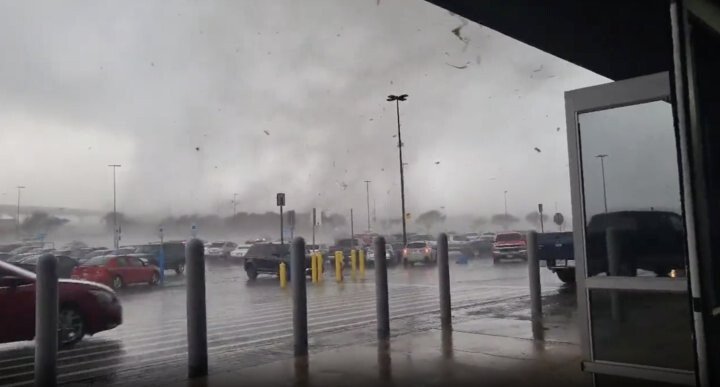 <i>James Watson/TMX</i><br/>A tornado rips through a Walmart parking lot in Round Rock
