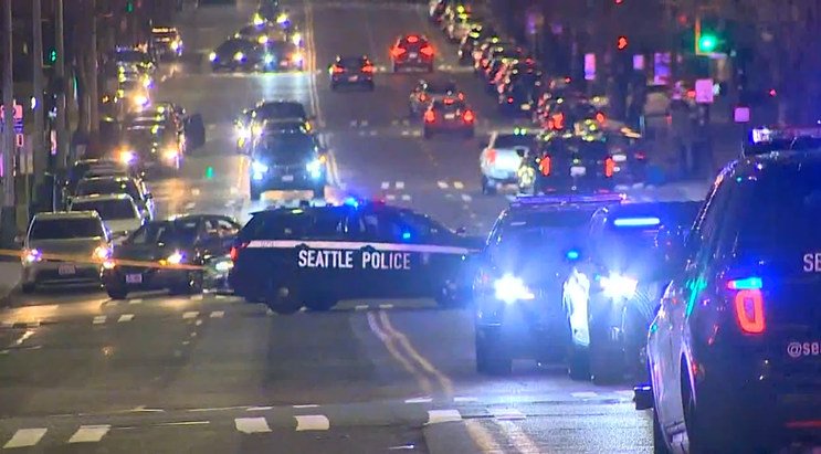 Seattle police shot and killed a man armed with a long gun outside the Federal Office Building in downtown Seattle Saturday night