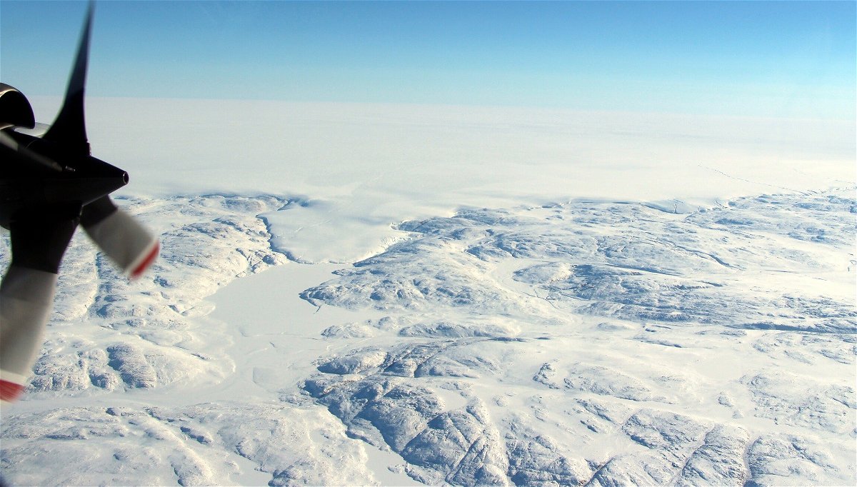 <i>NASA/John Sonntag</i><br/>The Hiawatha impact crater is covered by the Greenland Ice Sheet